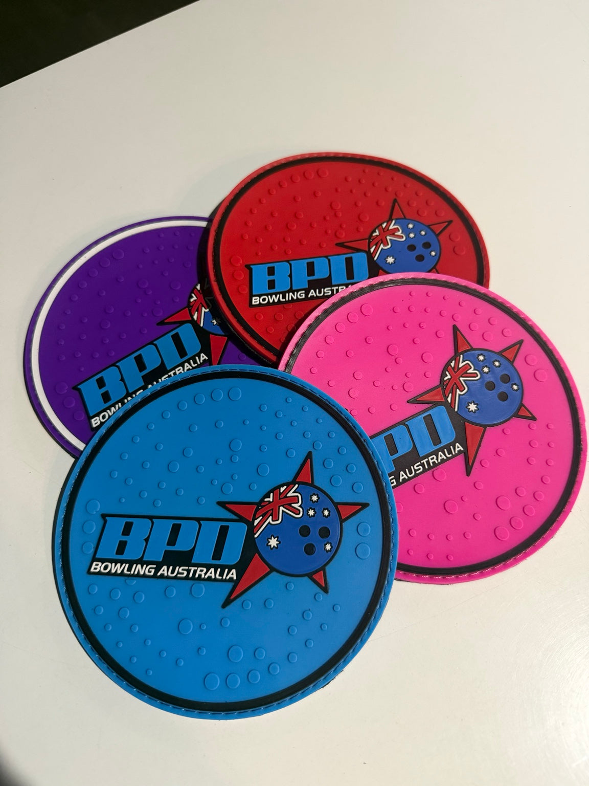 BPD rubber-backed bowling shammys in blue, pink, red and purple